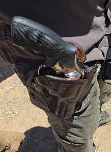 Revolver in a leather holster on the range